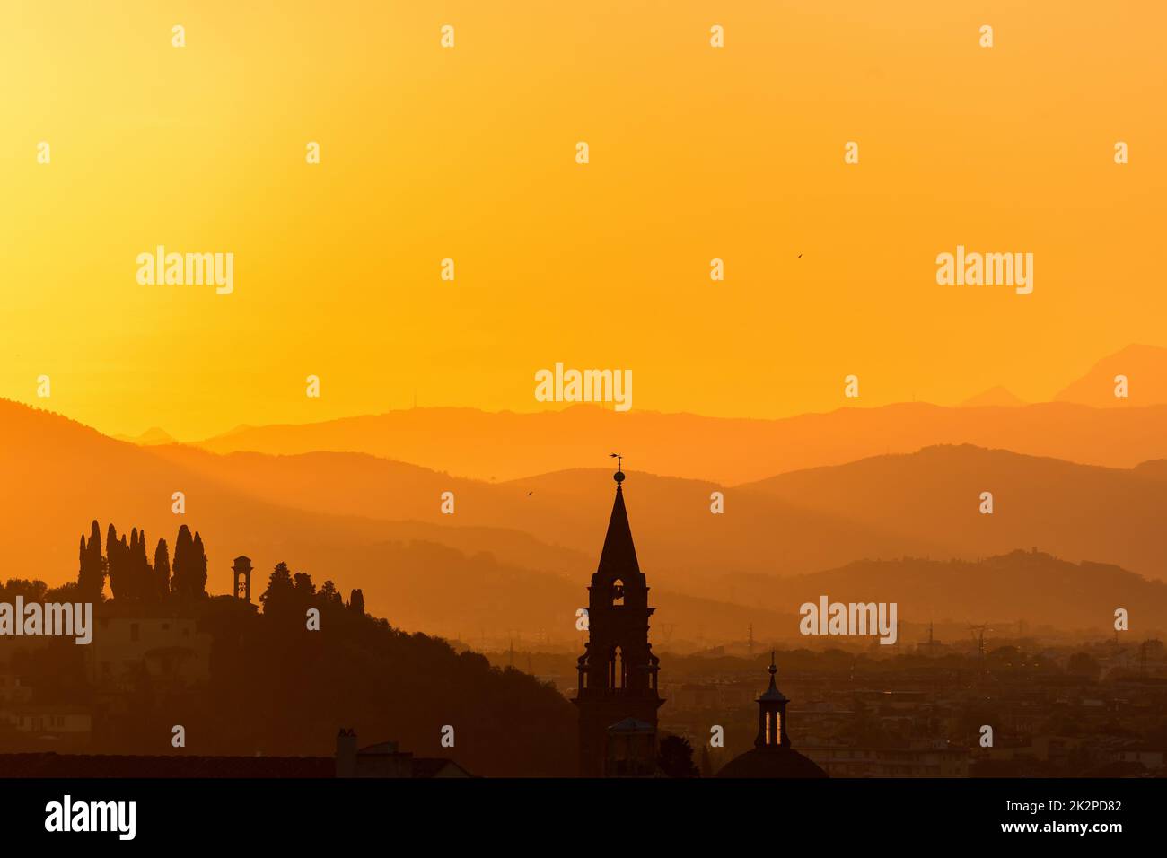 Church tower in the sunset silhouette Stock Photo - Alamy