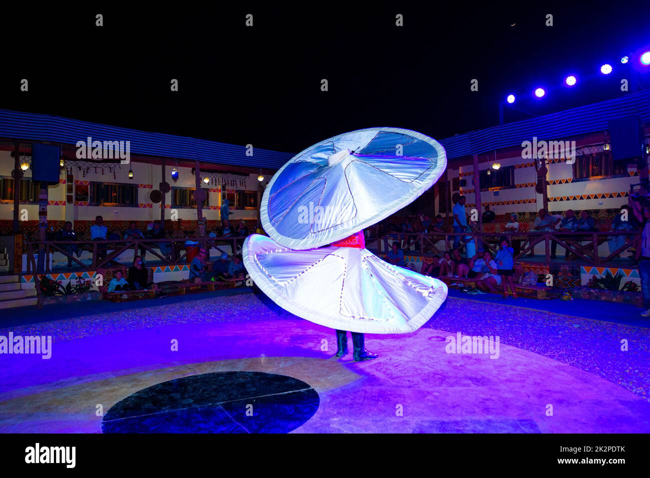 An Egypt show of a whirling dervish with a traditional custome at night Stock Photo