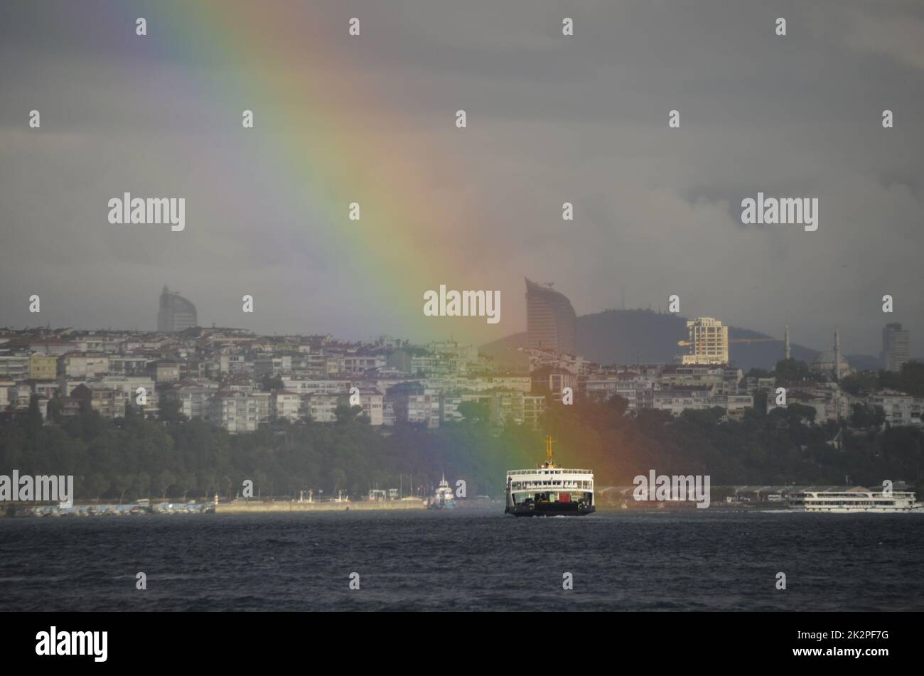 Rainbow, ferry and sea in Bosphorus, Istanbul, Turkey Stock Photo