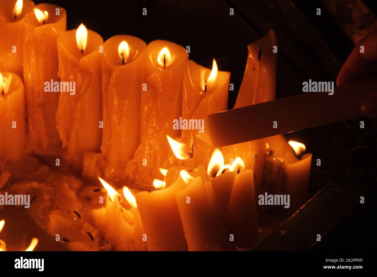 Lighting candles in chapel of Our Lady from the Kamenita vrata (Stone