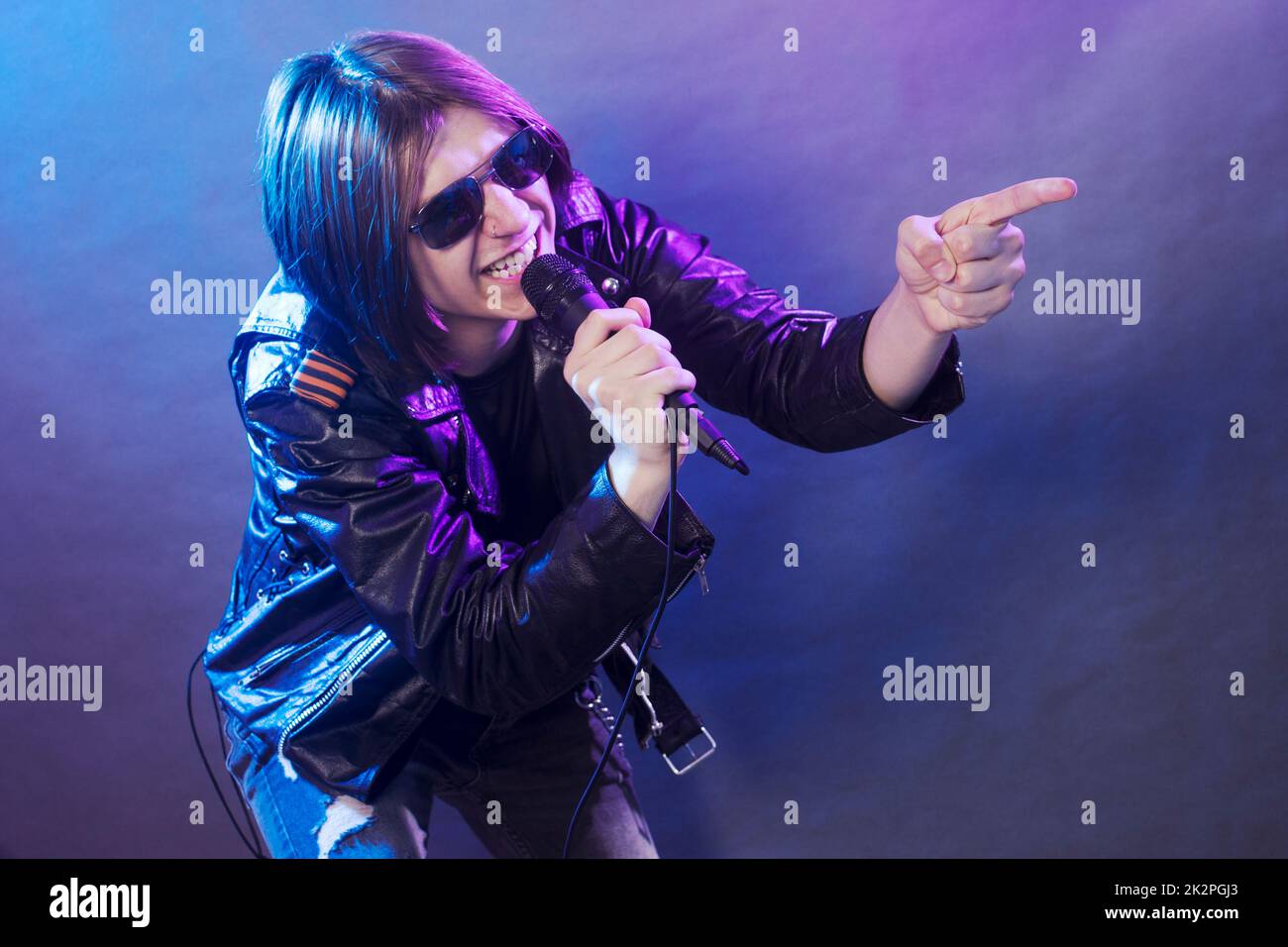 singing emo guy on stage Stock Photo