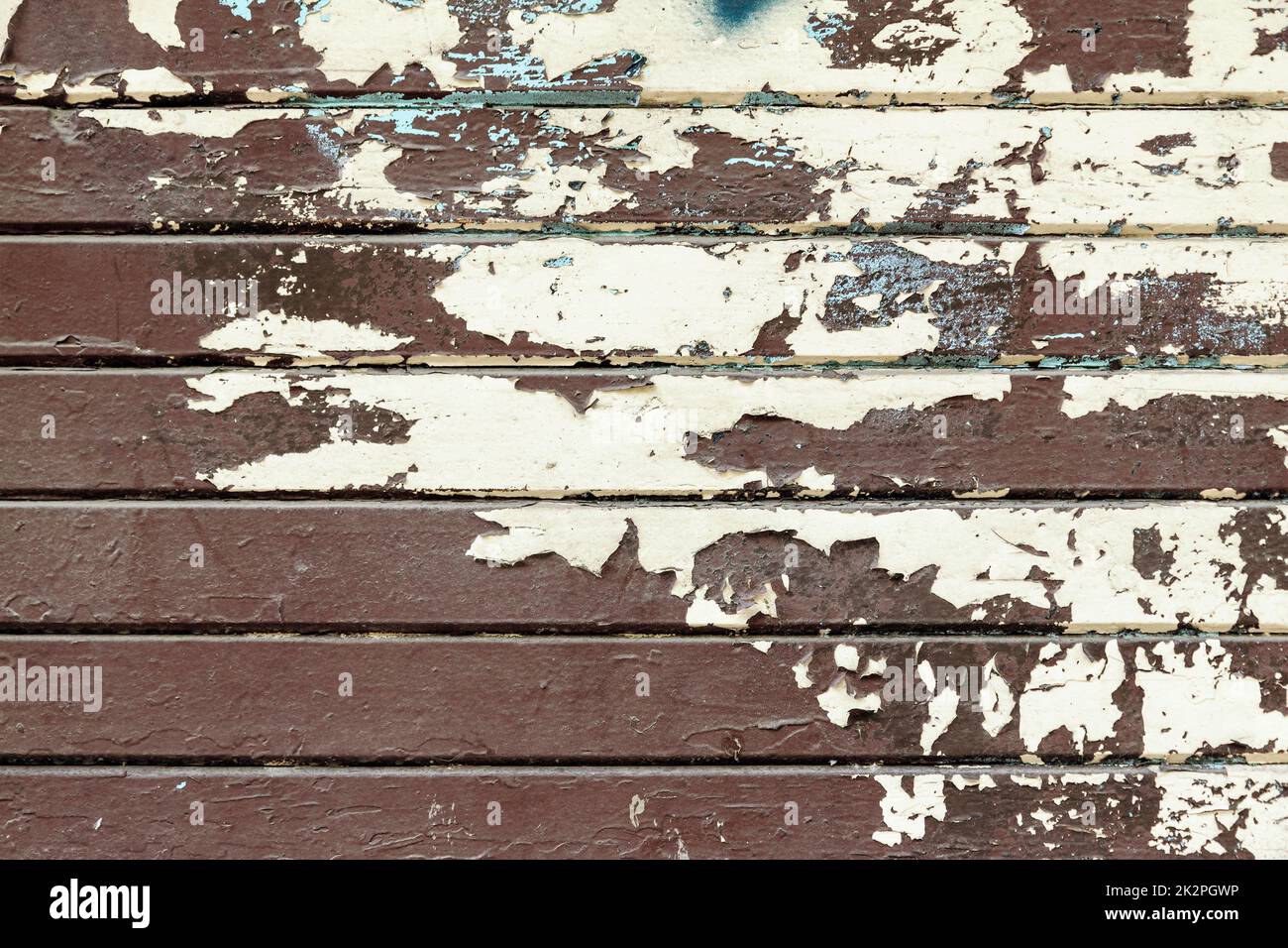 Boards of an old wooden fence with worn out paint Stock Photo