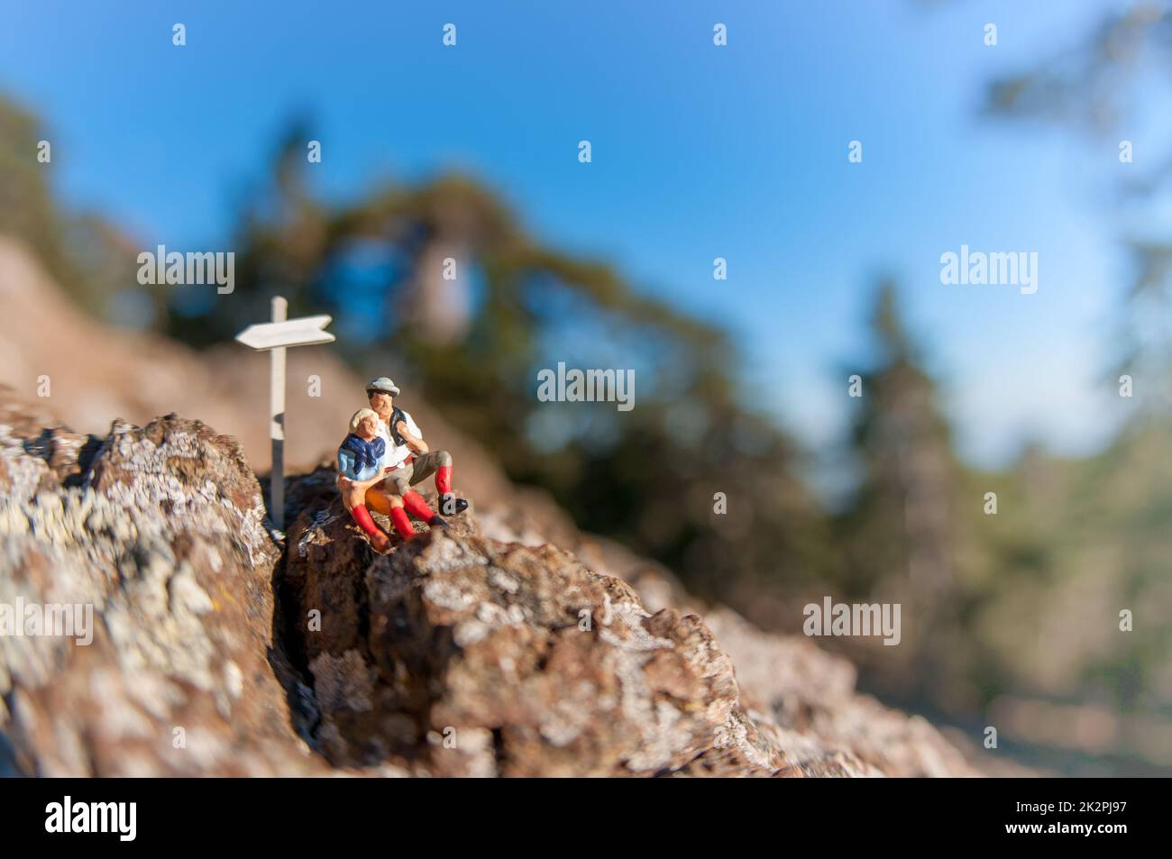 Two hikers with backpack relaxing on top of a mountain Stock Photo - Alamy