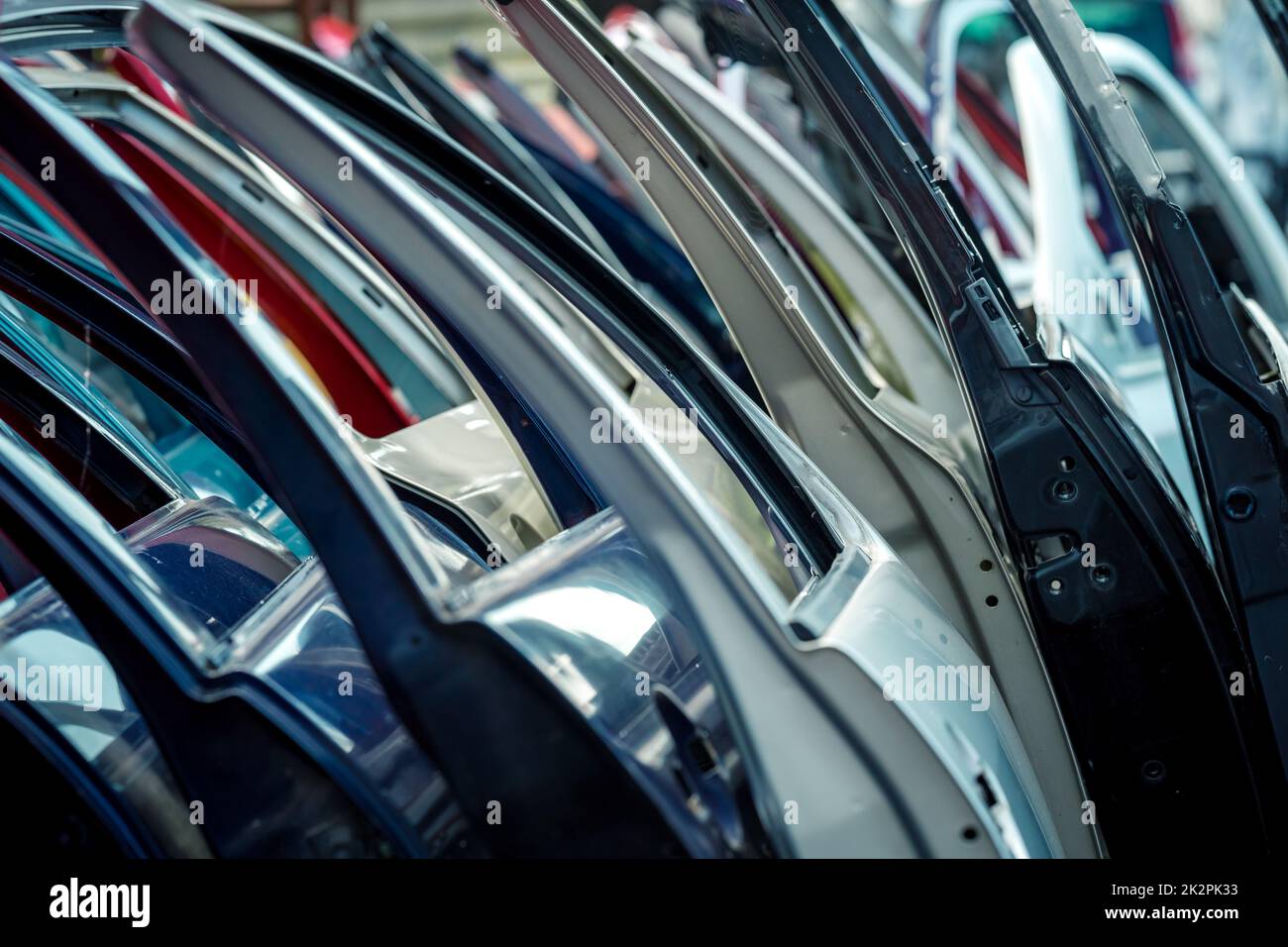 different colored car doors at a car junkyard Stock Photo Alamy