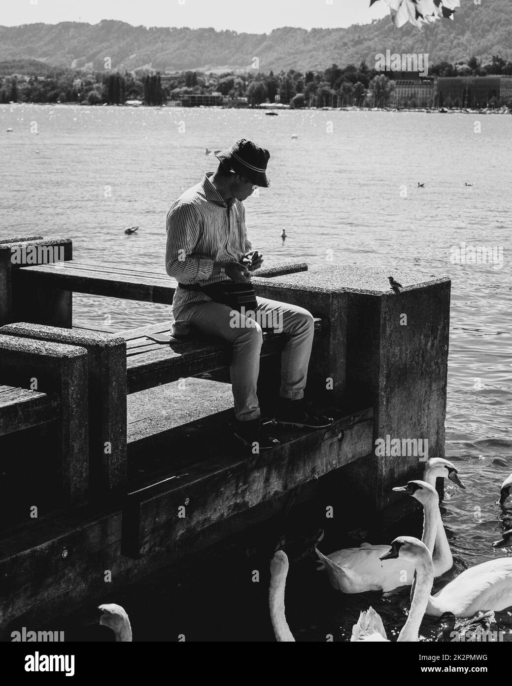 Man water feeding Black and White Stock Photos & Images - Alamy