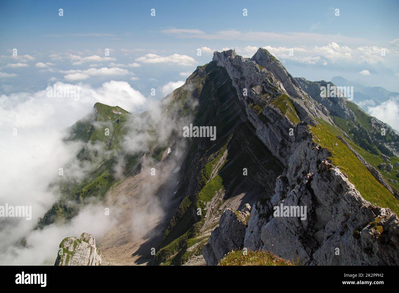 Alpine mountain landscape with clouds in Switzerland Stock Photo