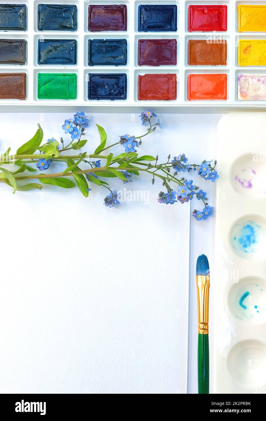 Flat lay sketchbook, watercolor brushes and color palette Stock Photo