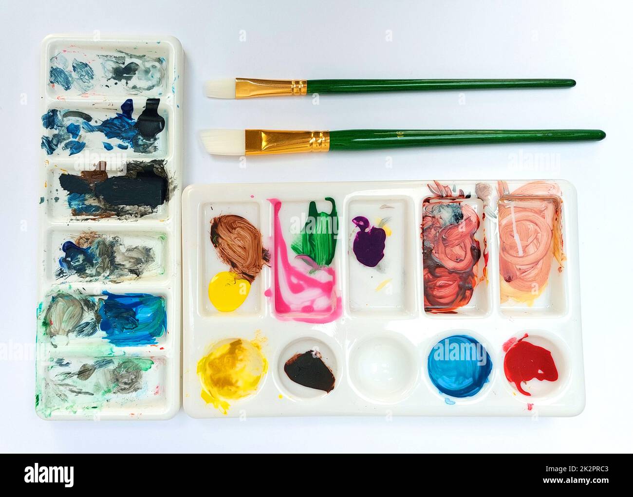 Flat lay sketchbook, watercolor brushes and color palette Stock Photo