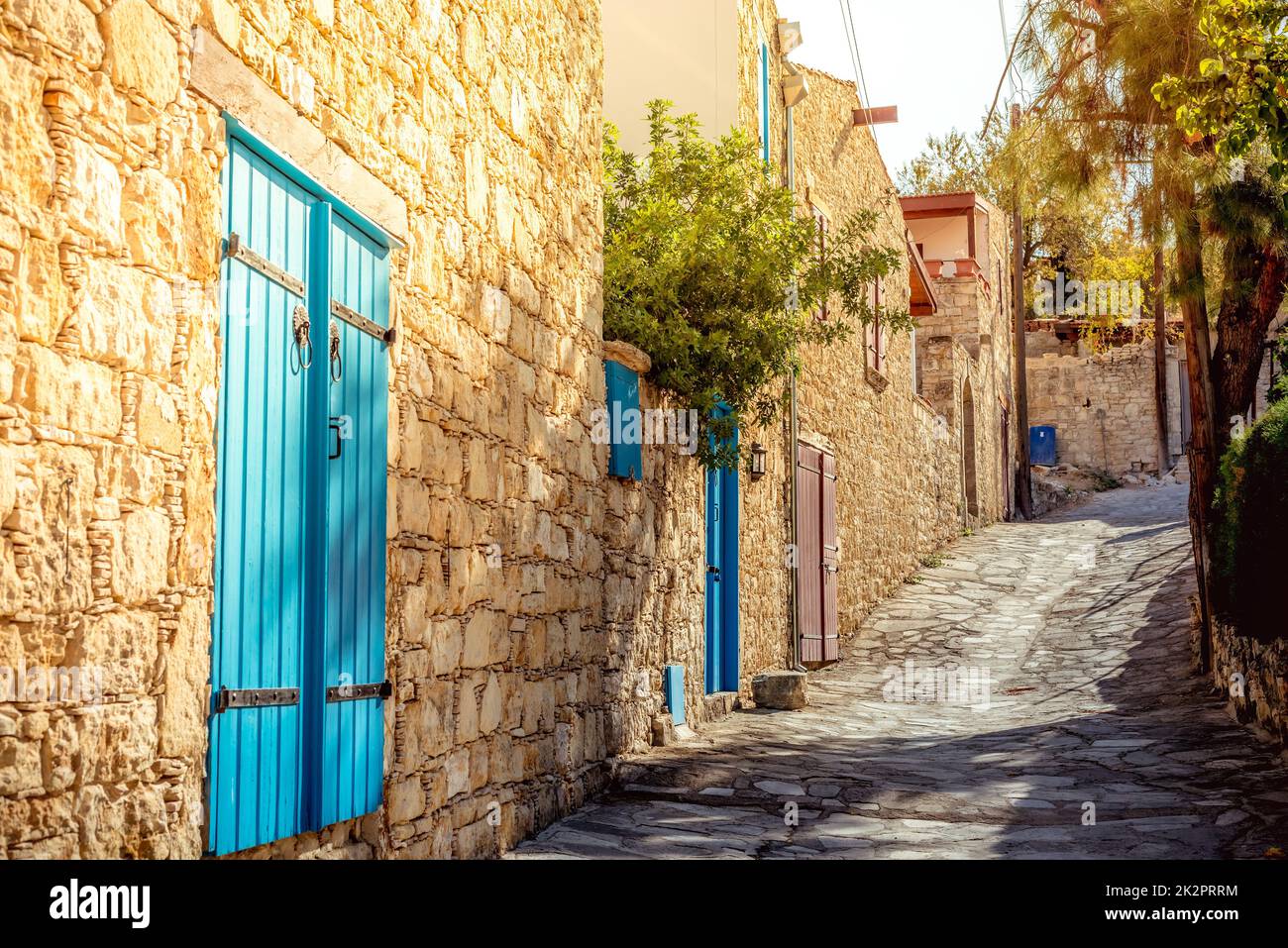 Narrow uphill cobbled street at Lofou village. Limassol District, Cyprus Stock Photo