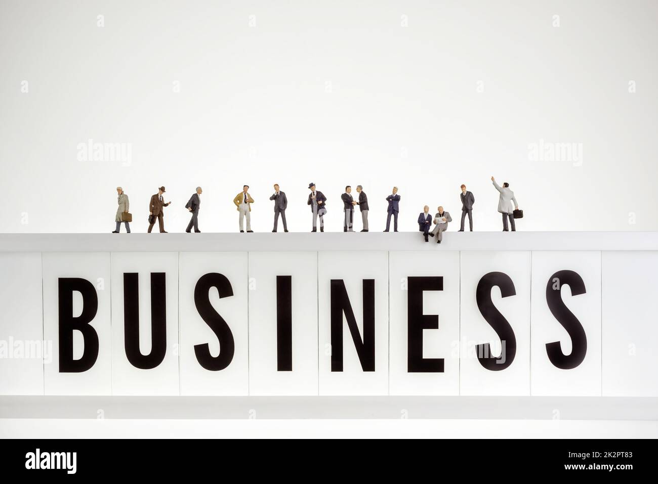Business word with crowd of miniature business people Stock Photo