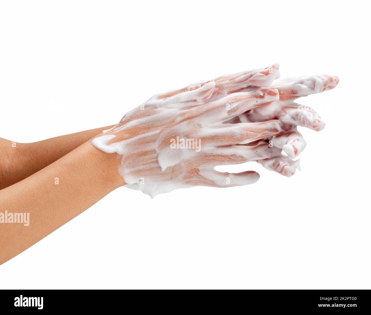 Female hand washing hands with soap lather on white background. Stock Photo