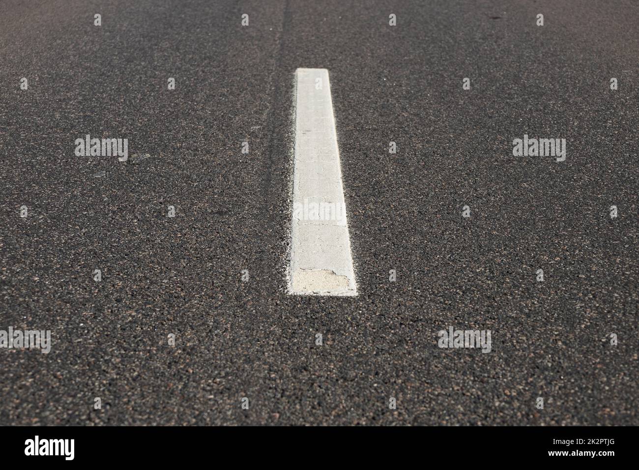 Asphalt road with single solid white line road marking Stock Photo Alamy