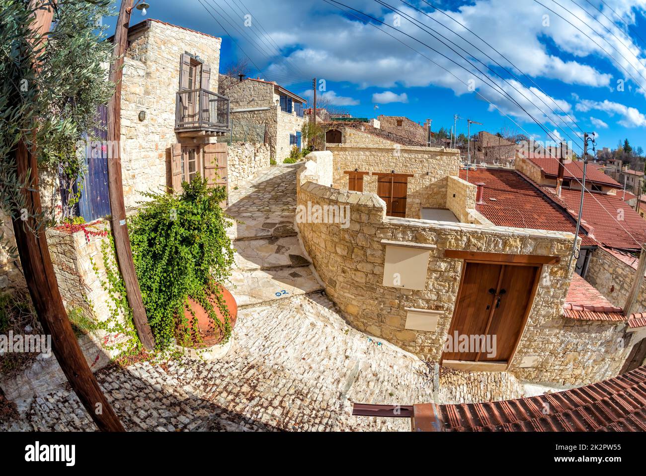 Empty street under sunny blue sky at Lofou village. Limassol District of Cyprus Stock Photo