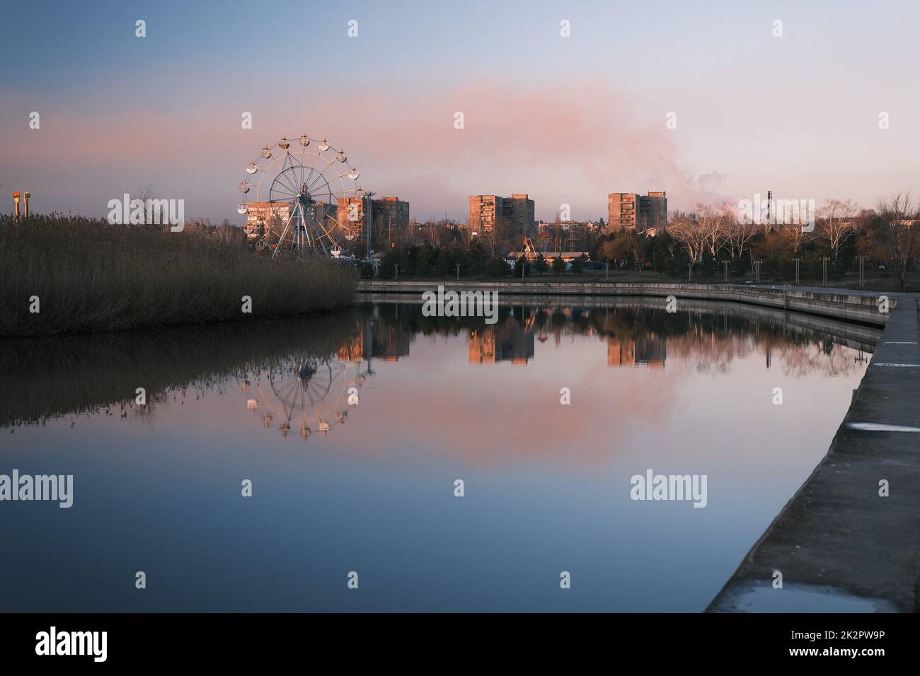 Extreme park near the river in autumn time evening, red sky beautiful sunset with red cloud Stock Photo