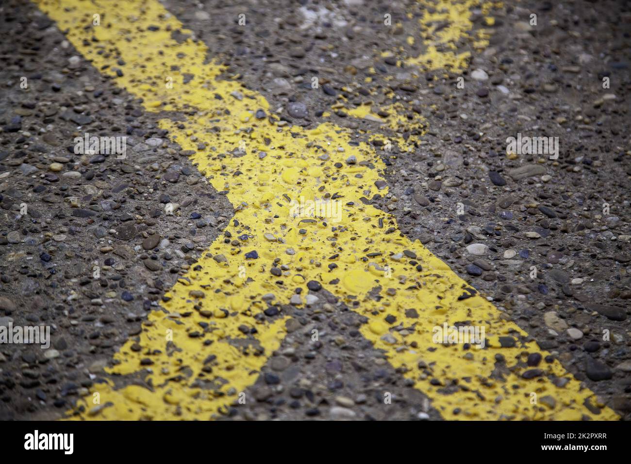 Yellow lines on the asphalt Stock Photo