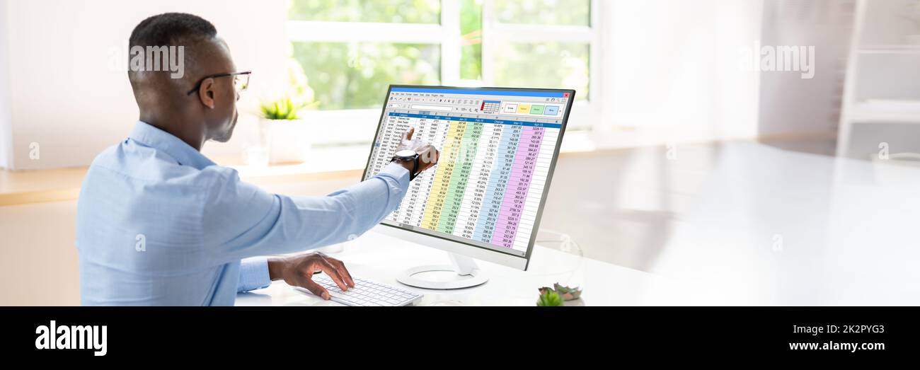 Analyst Employee Working With Spreadsheet Stock Photo