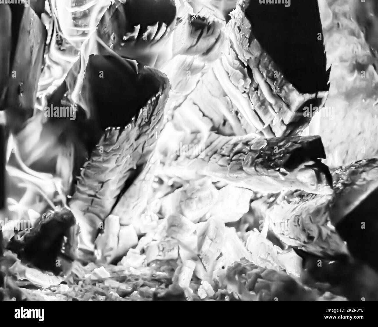 Beautiful old fireplace with light flame fire for heating building room