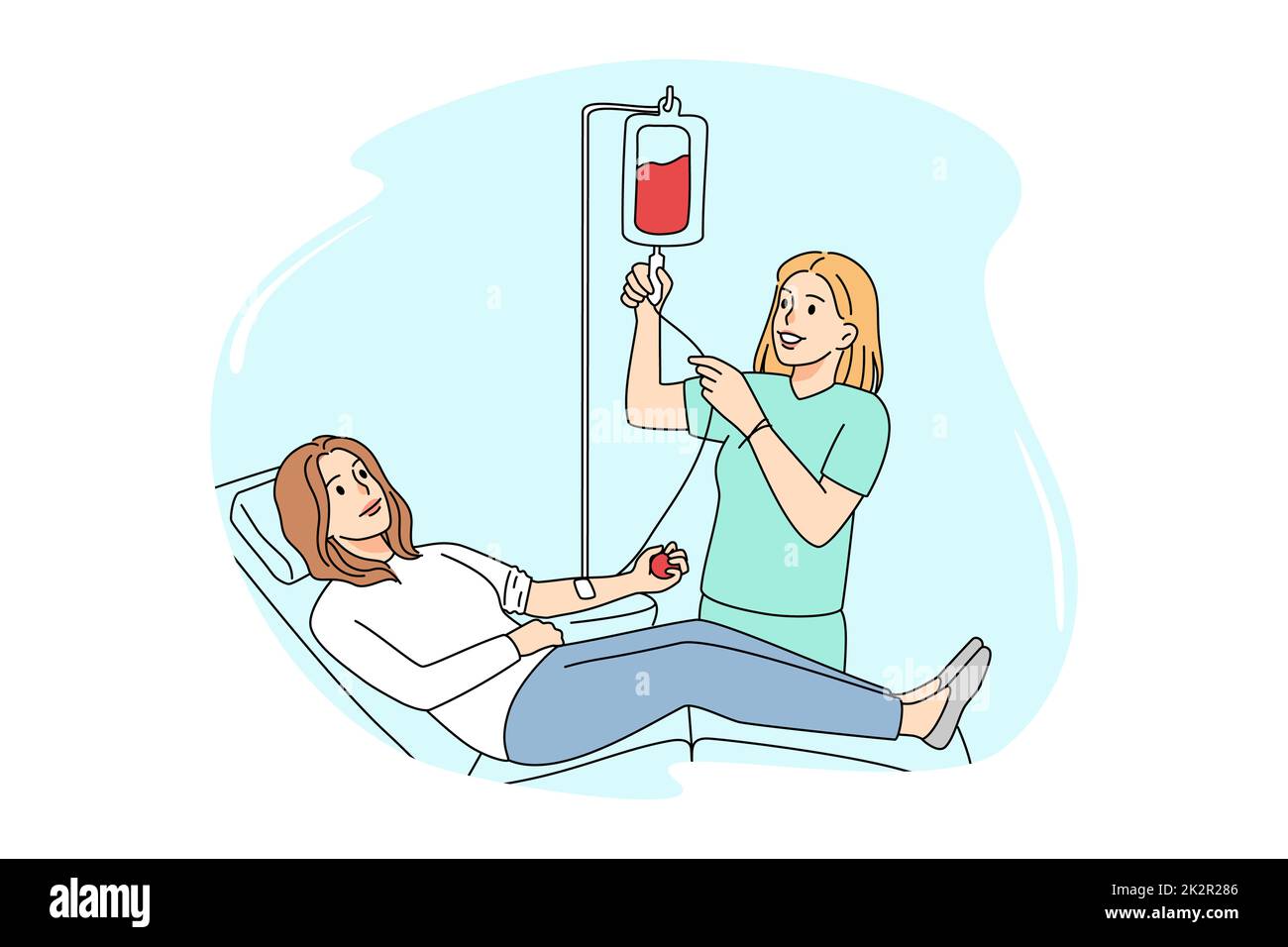 Female donor donate blood in clinic Stock Photo