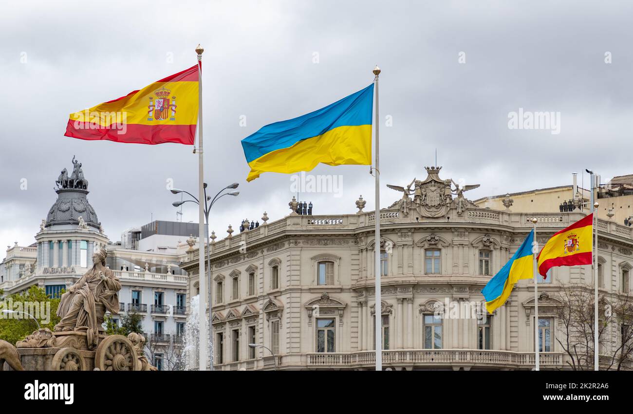 Fuente de Cibeles with Spanish and Ukrainian Flags Stock Photo