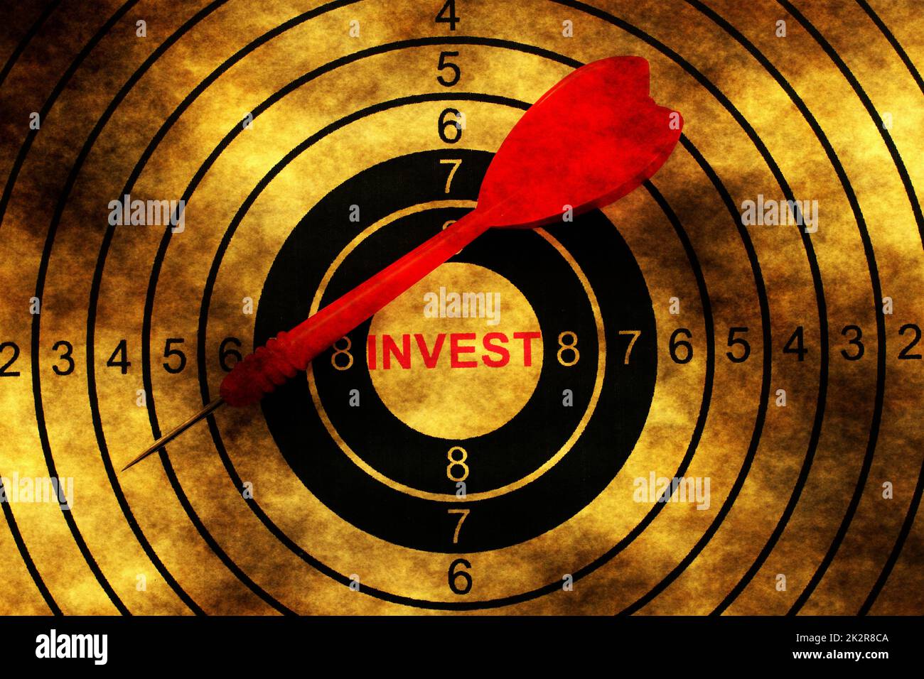 Invest target on grunge background Stock Photo