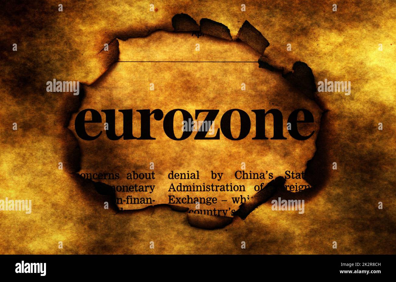 Eurozone on burning paper hole Stock Photo