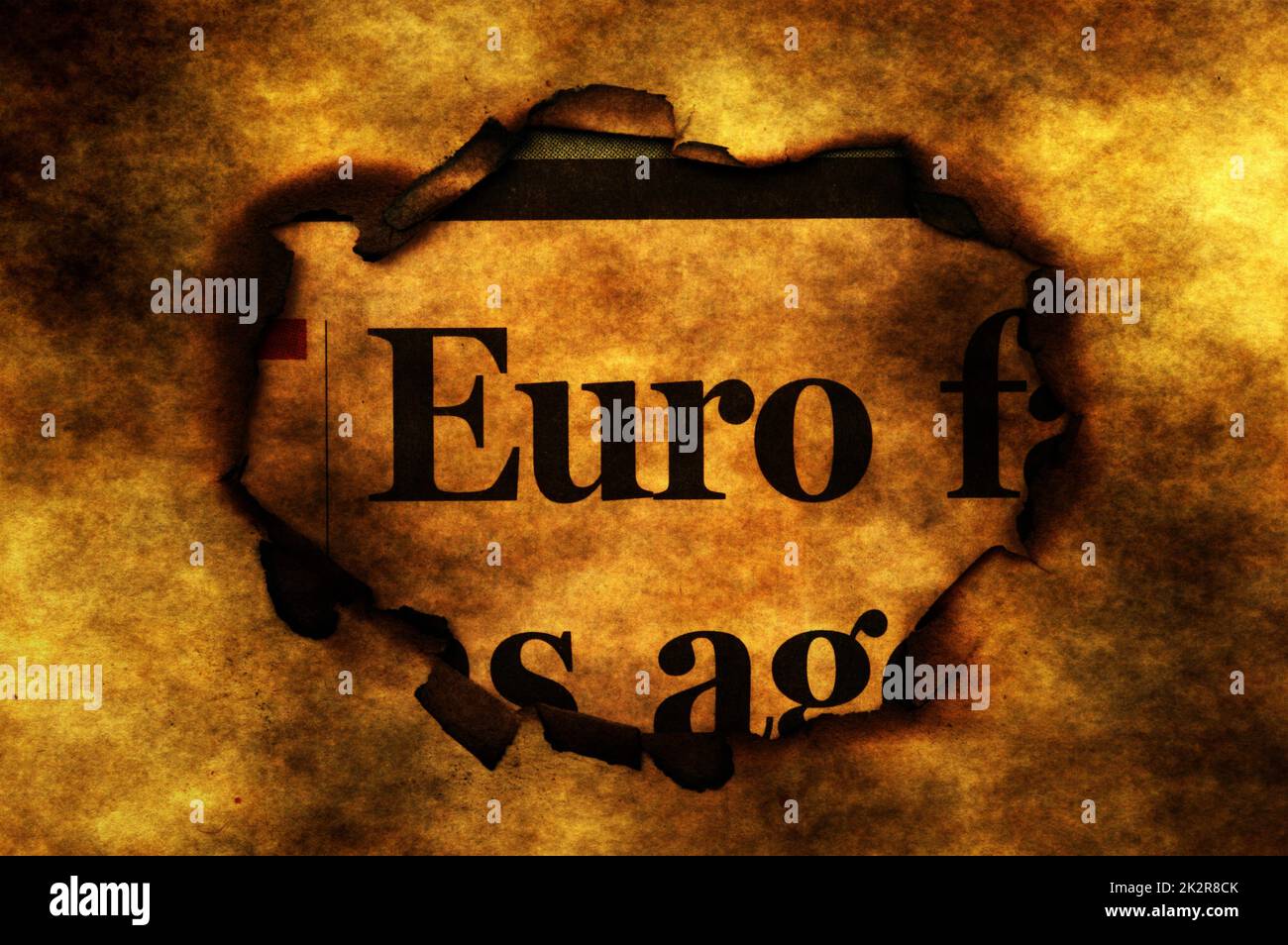Euro and burning paper hole Stock Photo