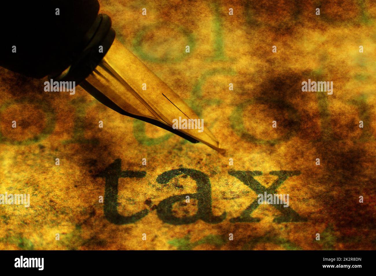 Fountain pen on tax text grunge concept Stock Photo