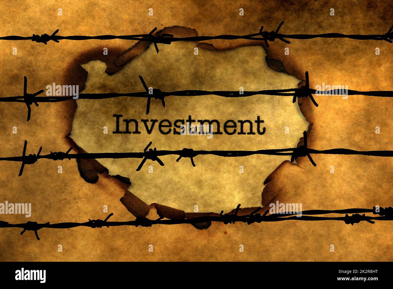 Investment concept against barbwire Stock Photo