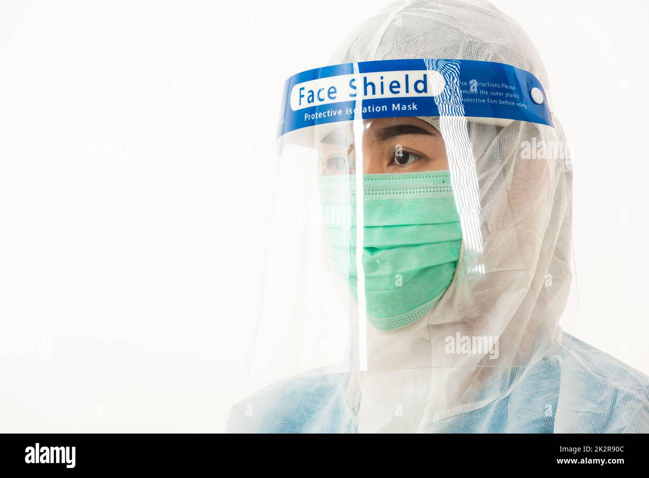 woman medical staff doctor in PPE uniform wearing a face mask ...