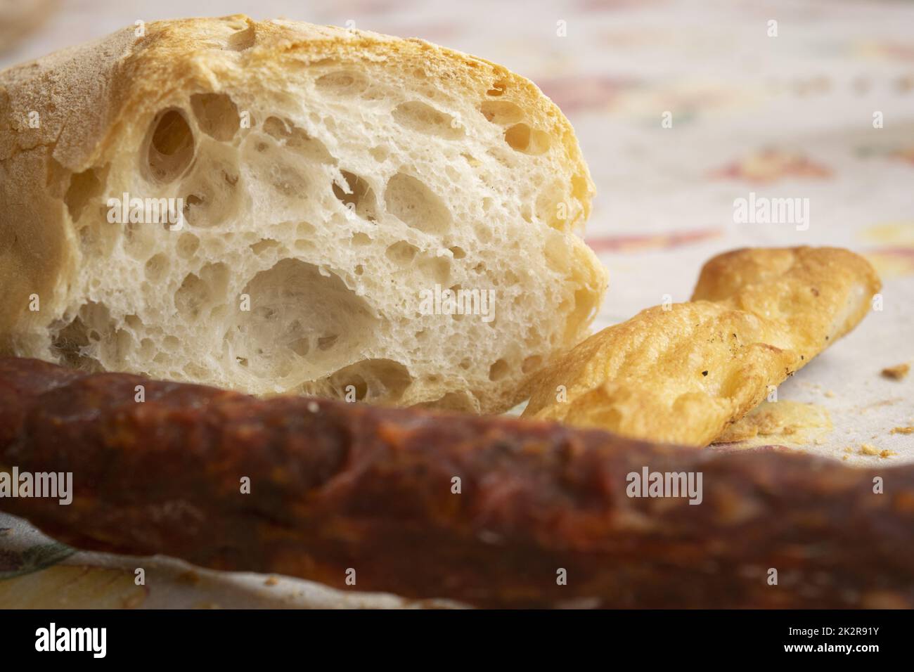 salami with a loaf of bread and white pizza Stock Photo Alamy