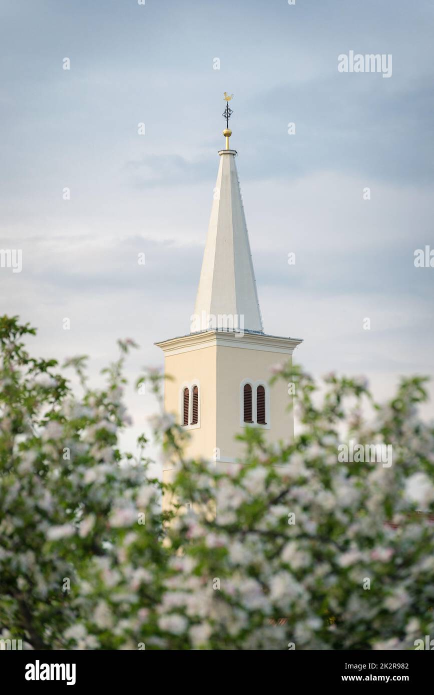 white belltower of a church in Burgenland Stock Photo