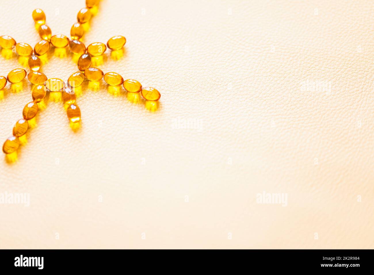 Vitamin D3 capsules. Medicine vitamins and dietary supplements. Selective focus. Close up of oil filled capsules suitable for: fish oil, omega 3, omega 6, omega 9, vitamin A, vitamin D, vitamin D3, vitamin E Stock Photo