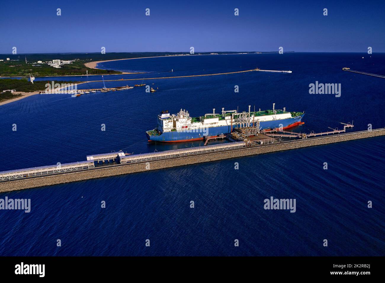 LNG transportation vessel Maran Gas Apollonia while discharging at terminal for liquified gas, connections, equipment and pressure reducers at baltic sea. (Western Europe) Stock Photo