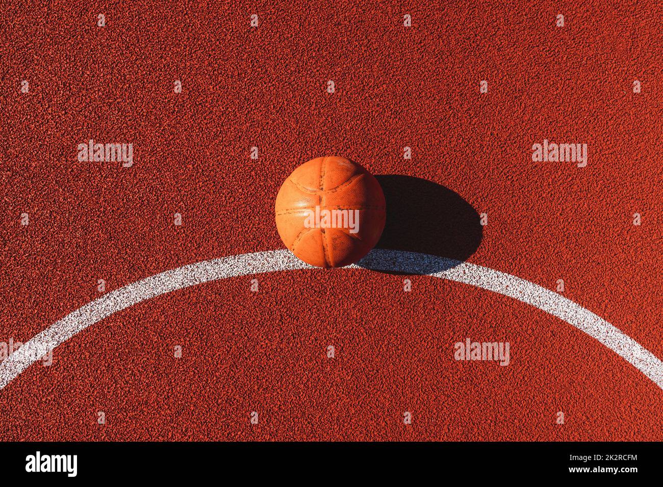 Basketball ball in the outdoors court Stock Photo