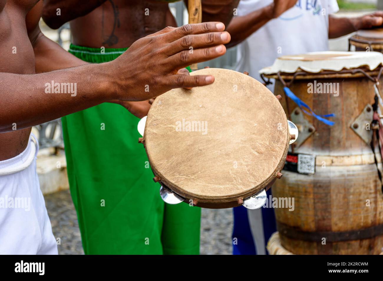 Group of musicians playing tambourine and atabaque in Pelourinho, Salvador Stock Photo