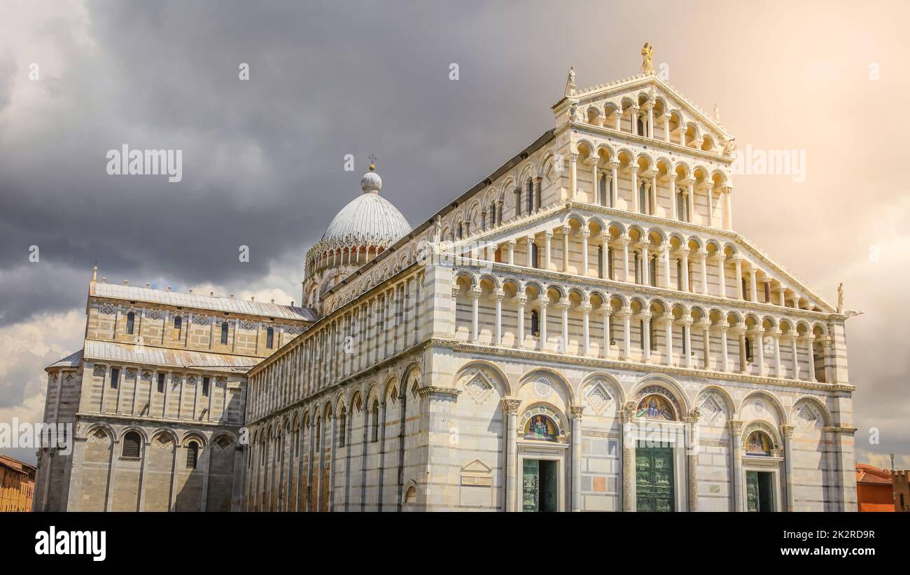 Miracle Square and Cathedral Duomo at dramatic sunset, Pisa, Tuscany, Italy Stock Photo