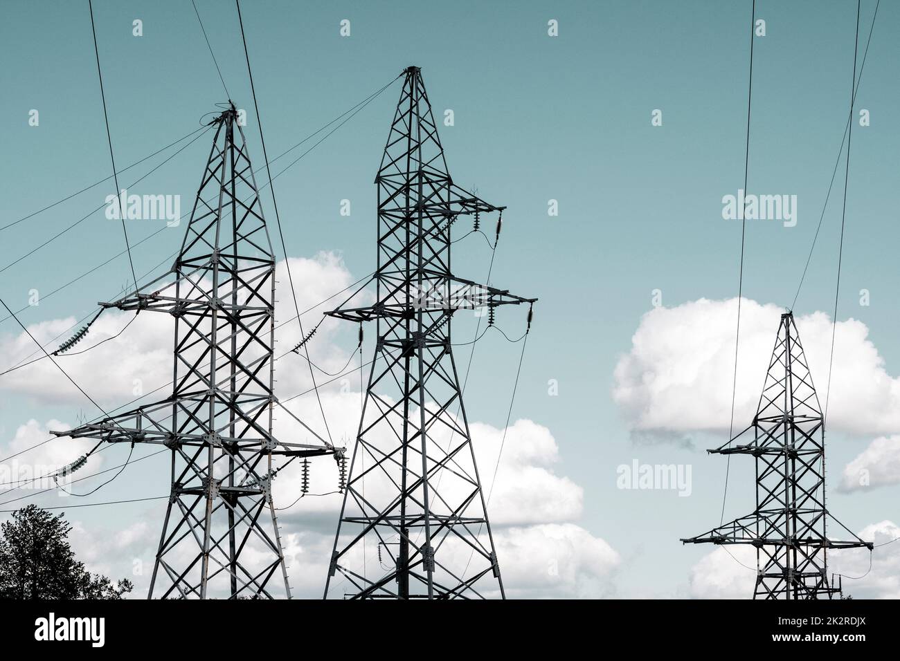 High voltage transmission towers on sky background Stock Photo - Alamy