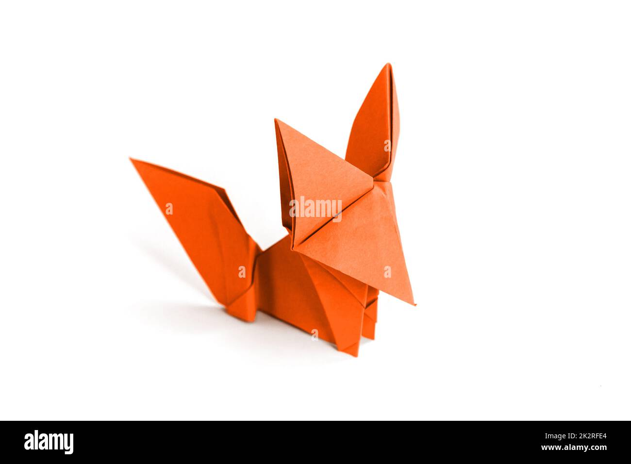 Orange paper fox origami isolated on a white background Stock Photo
