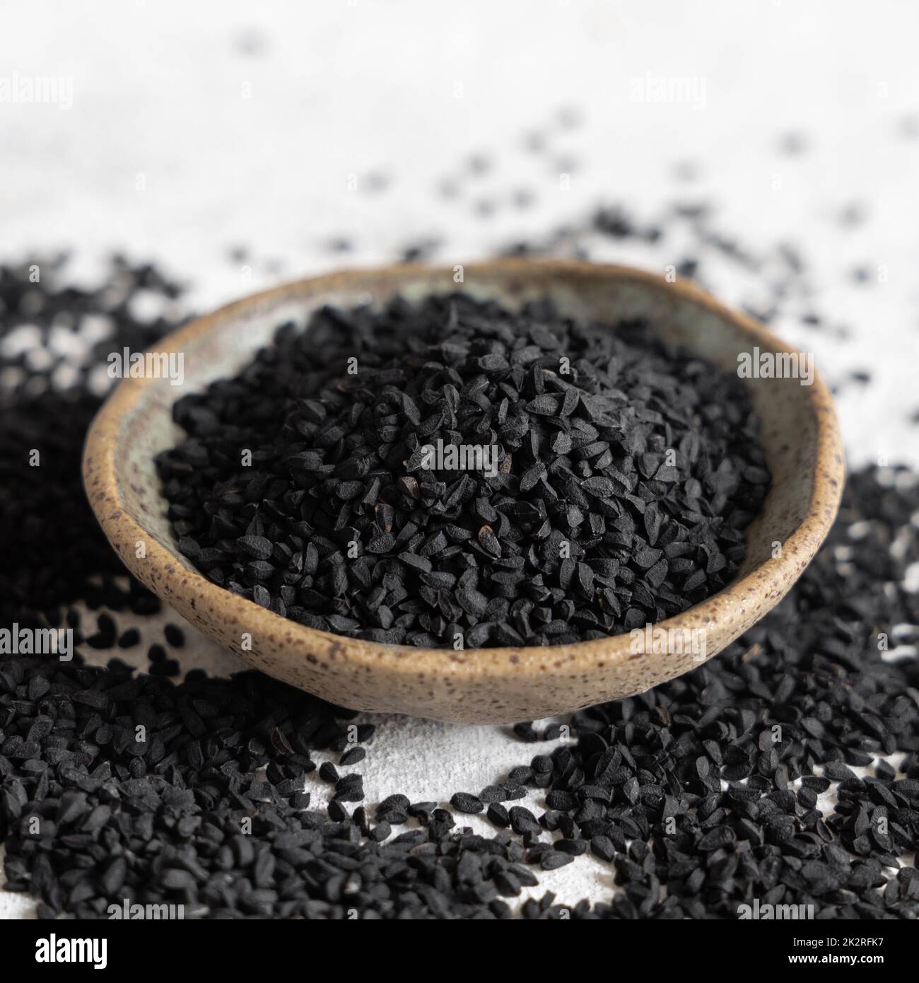 Indian spice Black cumin (nigella sativa or kalonji) seeds in bowl close up Stock Photo
