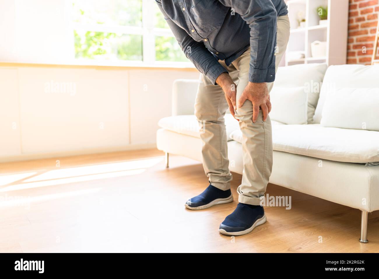 Man Having Knee Pain Stock Photo