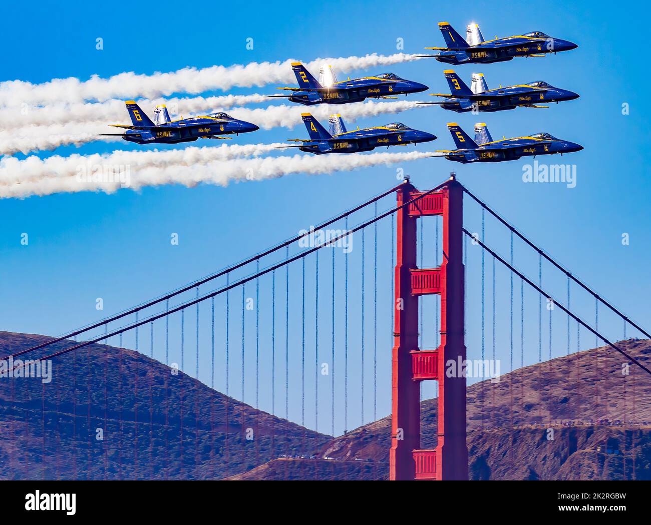 A group of Blue Angels soaring over the Golden Gate Bridge in San