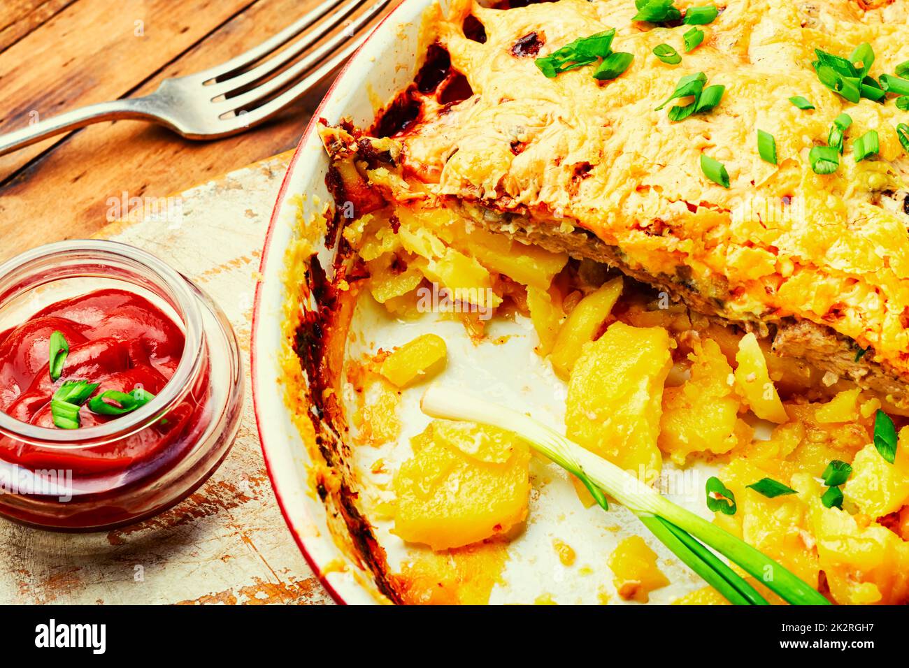 baked-meat-with-potatoes-and-cheese-stock-photo-alamy