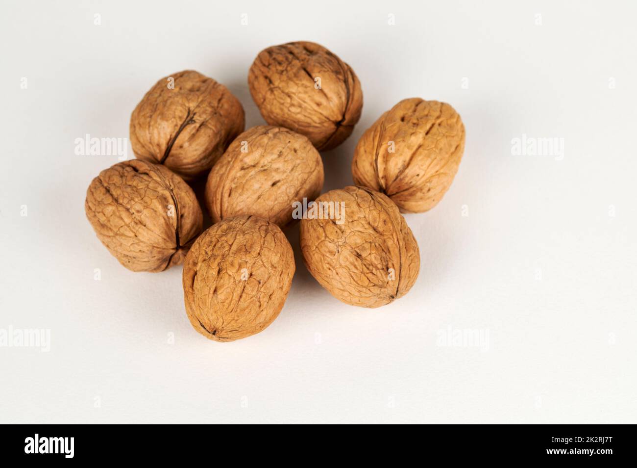 Whole walnuts on white Stock Photo