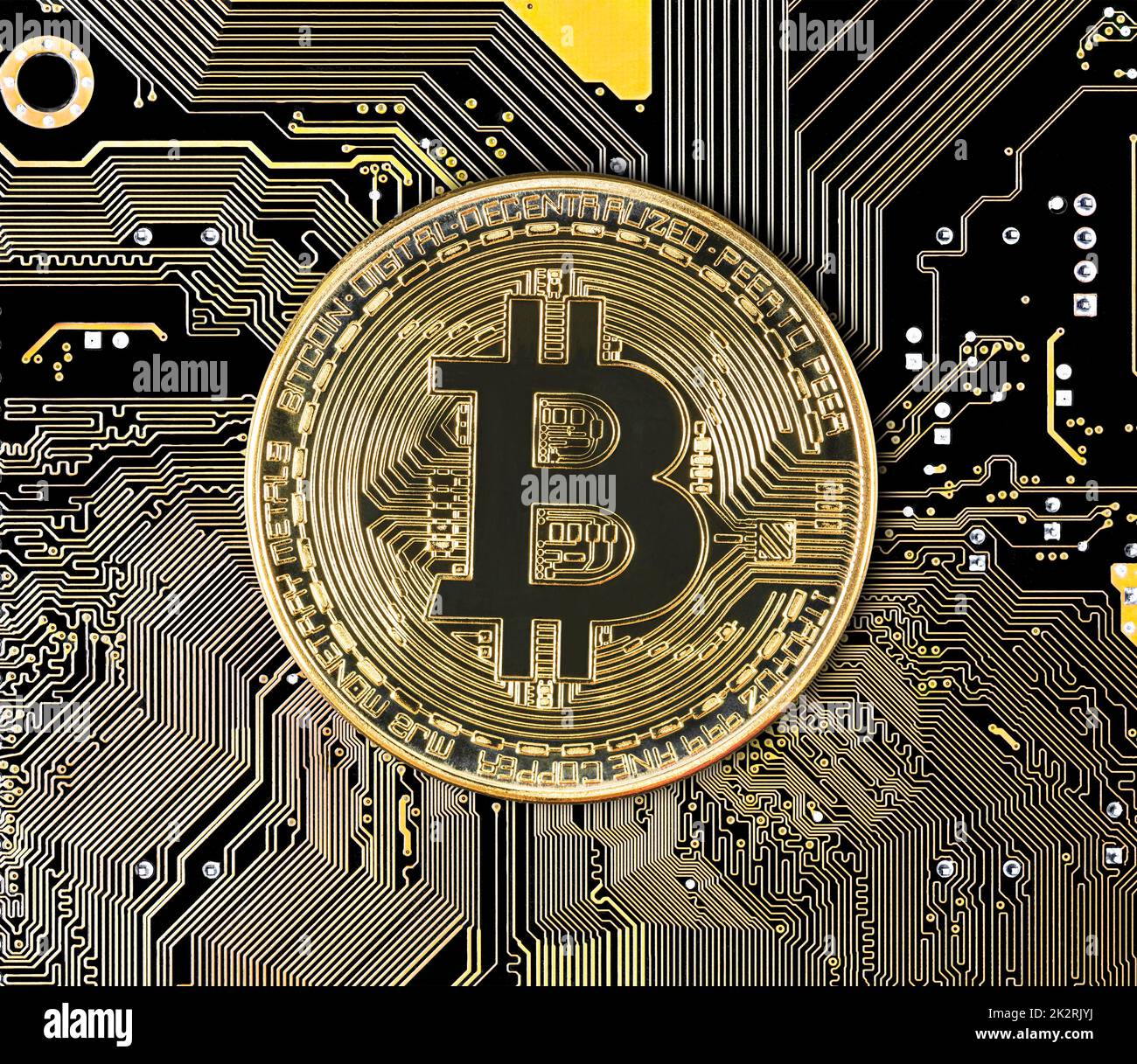 Bitcoin coin cryptocurrency on circuit board Stock Photo