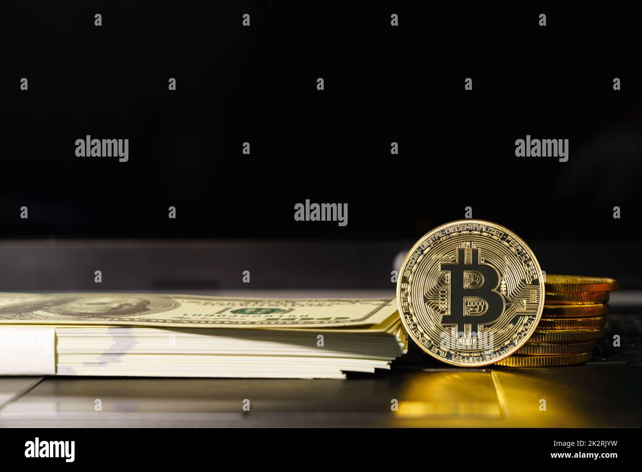 Bitcoins coins and banknotes on keyboard compute Stock Photo