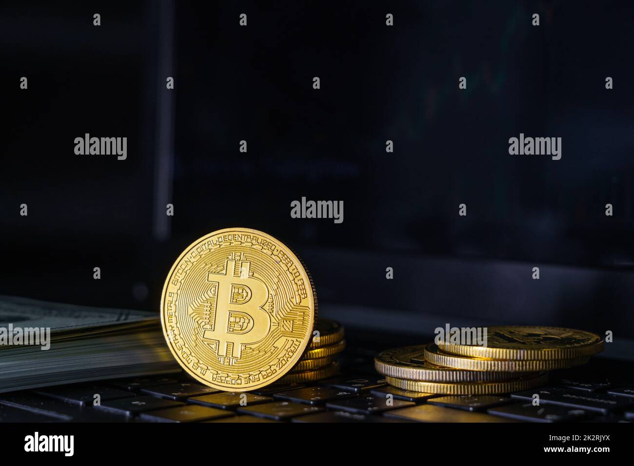 Bitcoin coins on keyboard computer with black background Stock Photo