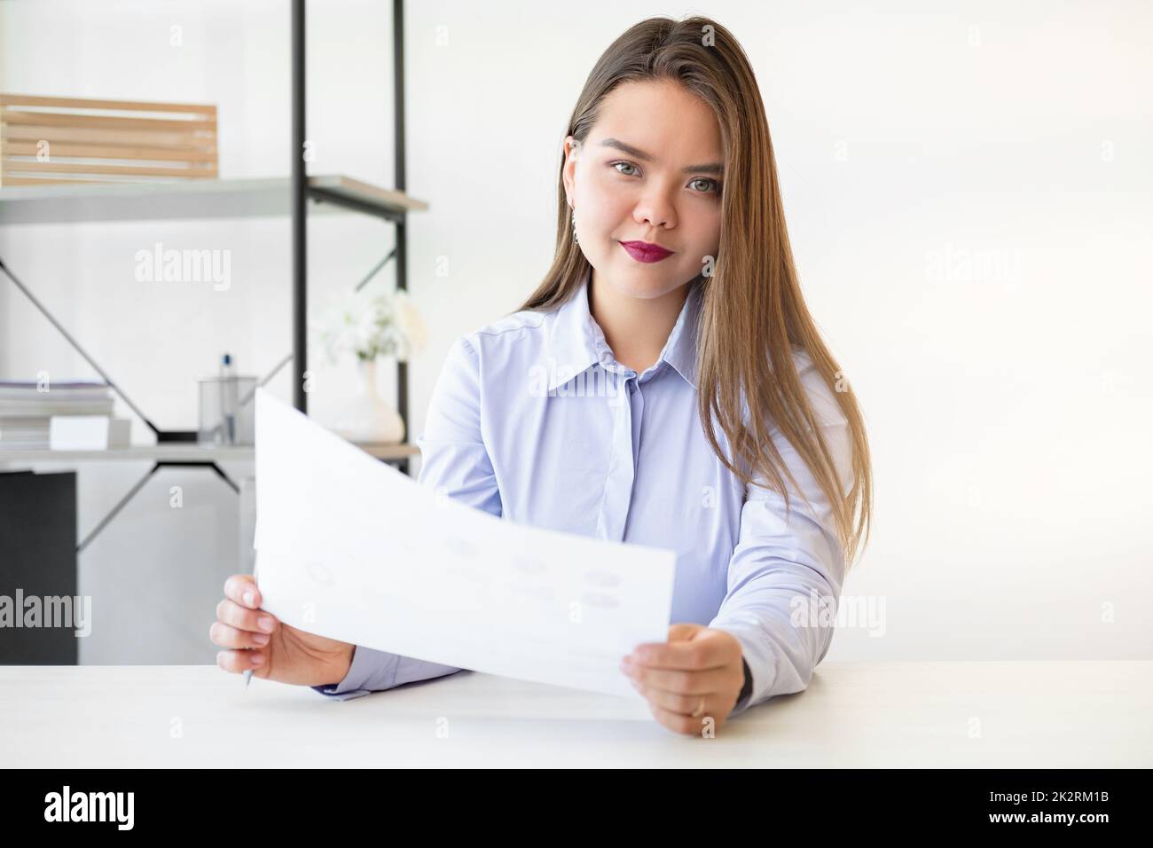 Female career. Project management. Professional success. Confident ambitious smart woman with paper work at light home office on white copy space back Stock Photo