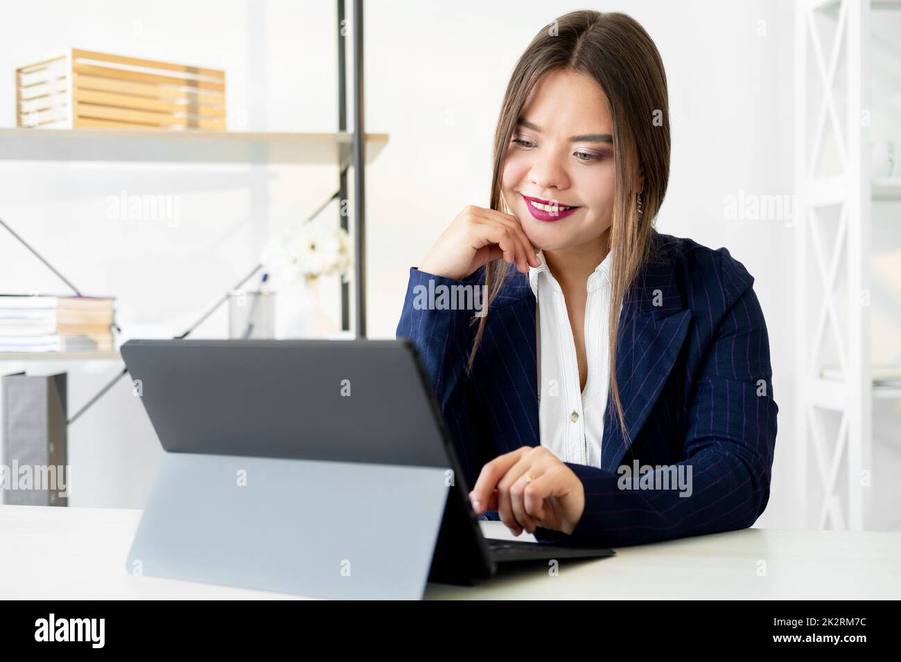 Video conference. Business webinar. Zoom chat. Online corporate meeting. Cheerful confident female leader discussing project strategy with team using Stock Photo
