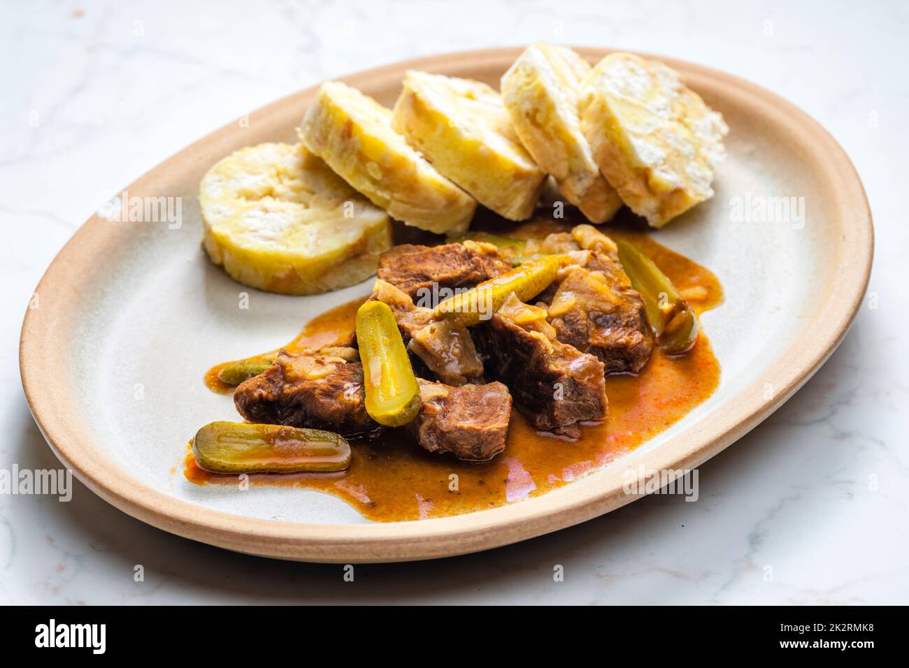 beef meat with picles sauce and dumplings Stock Photo