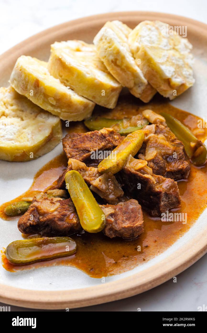 beef meat with picles sauce and dumplings Stock Photo